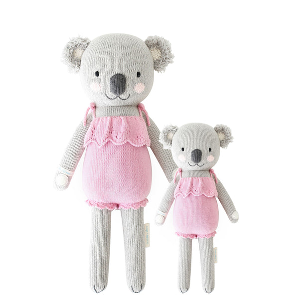 2 different sized koala stuffies wearing pink dresses