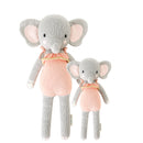 2 different sized elephant stuffies wearing pink dresses
