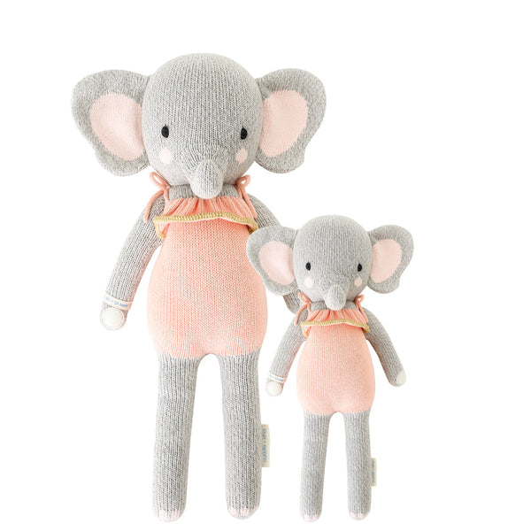 2 different sized elephant stuffies wearing pink dresses