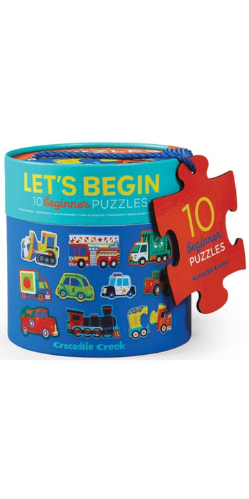 Let’s Begin 10 Beginner Puzzles: Vehicles - Colorful cylindrical fabric case with zipper, featuring bright vehicle illustrations and labeled “Let’s Begin 10 Puzzles,”.