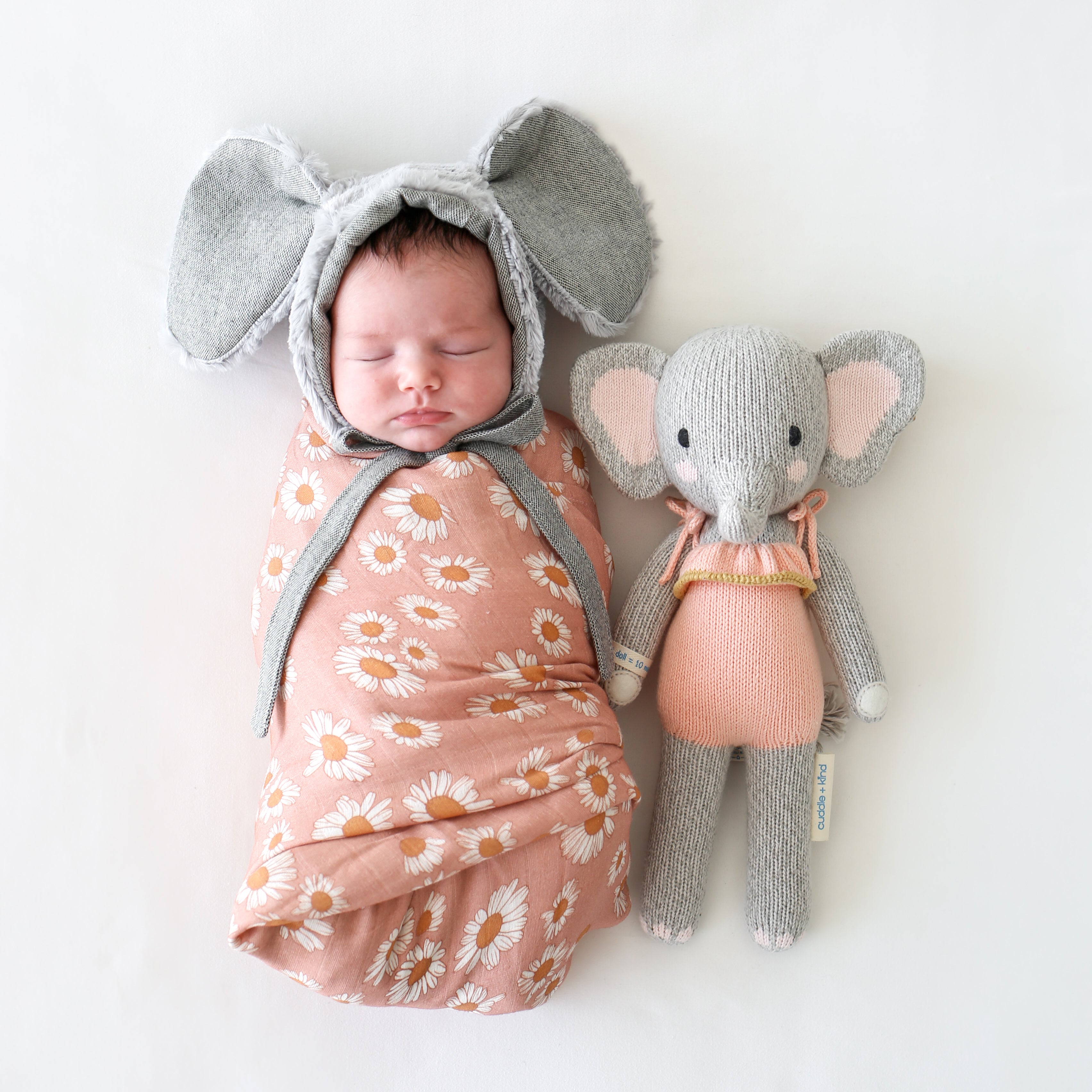 An elephant stuffy beside a baby