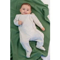 A baby wearing the Mini Waffle Collection - Footed Sleeper - Light Gray