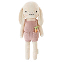 A bunny stuffy wearing a pink dress