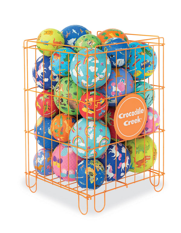 An orange metal crate holding a variety of balls