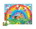 5 fairies dance and fly in front of a rainbow in a field of flowers. In the back there are two mushroom homes and a bunny