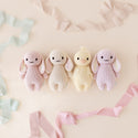 4 different coloured baby bunny stuffies