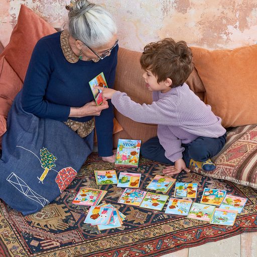 A child and grandmother playing Create a Story