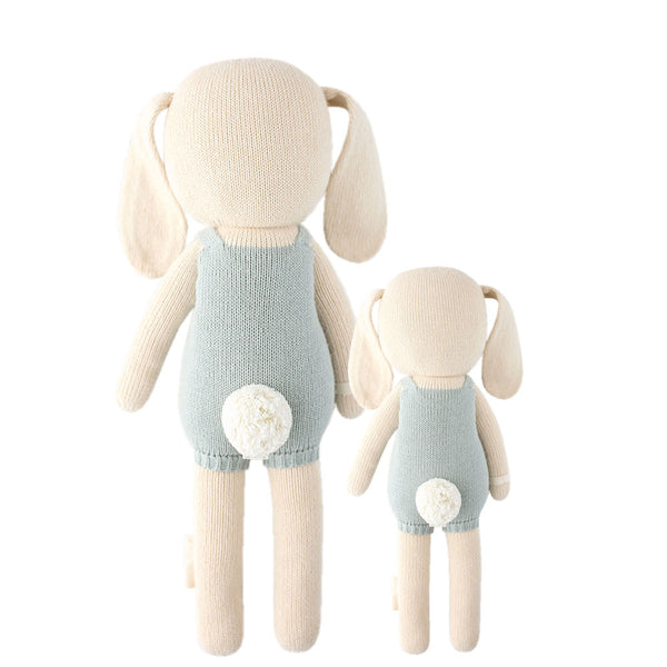  2 different sized bunny stuffies wearing blue overalls