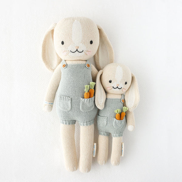 2 different sized bunny stuffies wearing blue overalls