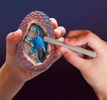 I Dig It! Dragon Egg - Handheld unique Canadian handmade dragon egg excavation toy with blue dinosaur inside, ideal gift for kids.