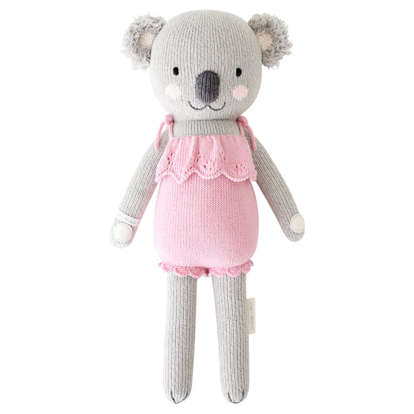 A koala stuffy wearing a pink dress