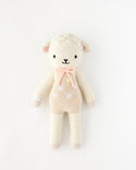  A lamb stuffy in pink polka dot overalls