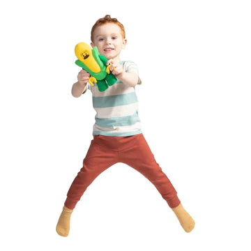 A kid holding the LEGO Corn Cob Guy Plush Minifigure